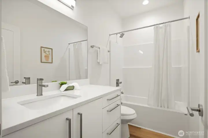 The full bath is across the hall from the 2nd and 3rd bedrooms.