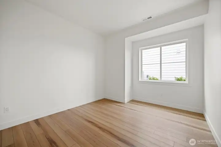 The third bedroom is also generously sized and looks to the side yard.