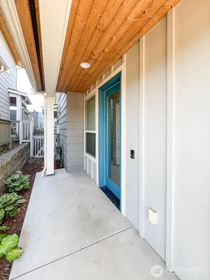 Private front door with covered entry, great for packages and rainy days.