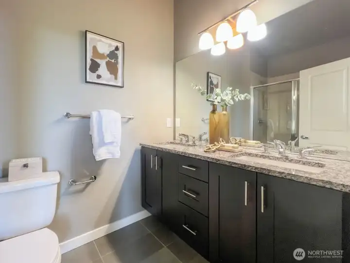 Double sink and vanity in the primary bathroom.