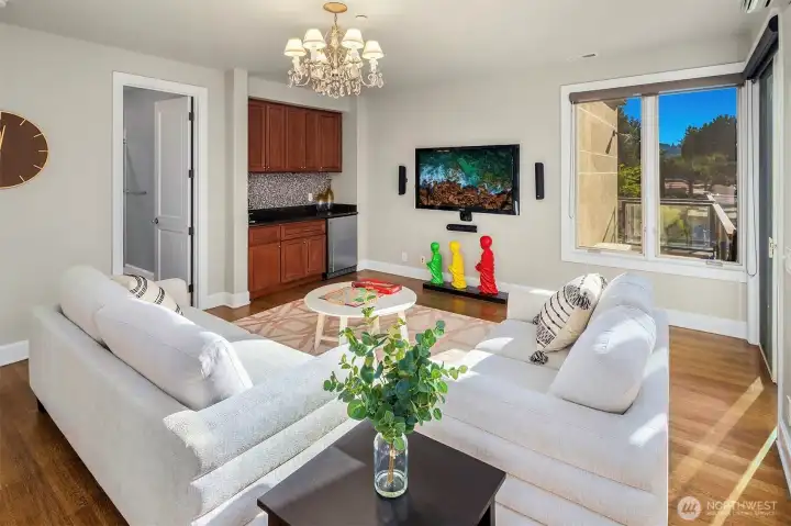 Second floor large flex space has a wet bar and opens to the roof rooftop deck