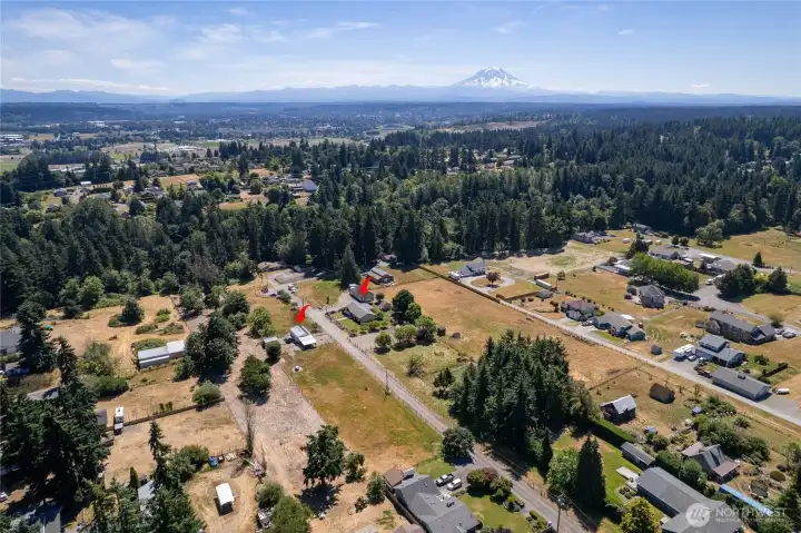 Beautiful dual-parcel property offering exceptional flexibility and space. One parcel features the home and detached garage, while the second includes pastures, a horse arena, and a barn, with effective field drainage designed to support year-round usability. The parcel with the barn is buildable for an additional residence and potential ADU, buyer to verify to their satisfaction. A rare opportunity in Tacoma.