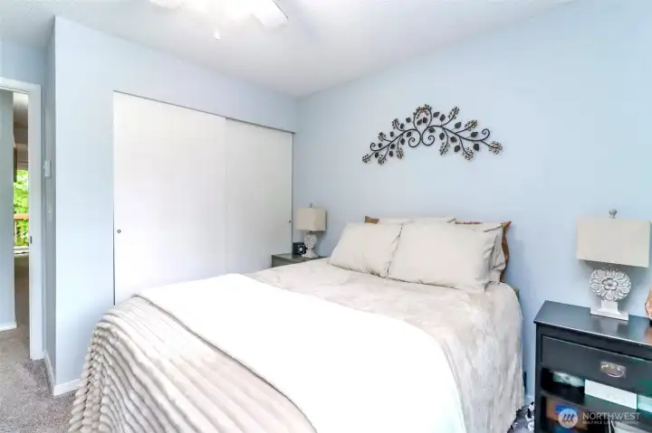 Primary bedroom with large closet and lots of natural light