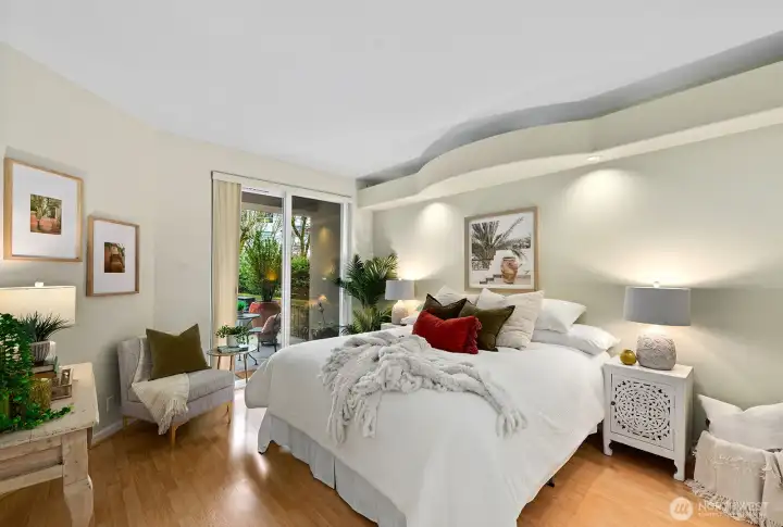 Primary large bedroom with overhead built in lighting and a slider to the Large back patio.