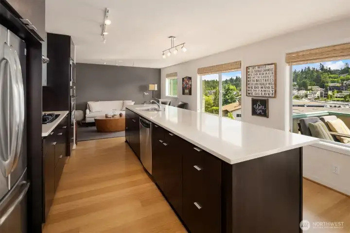 Oversized eating bar with spacious kitchen and ample storage. Oversized eating bar with spacious kitchen and ample storage.