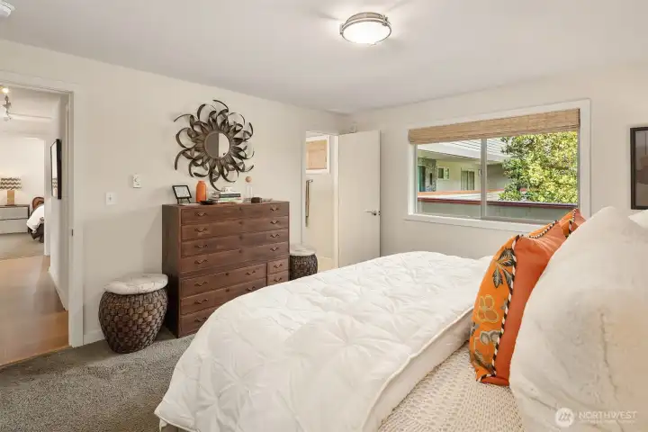 Primary bedroom with custom closet shelving & ensuite bathroom. Primary bedroom with custom closet shelving & ensuite bathroom.