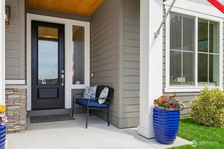 Located on a premium lot, looking down street, this is a very welcoming covered front porch!