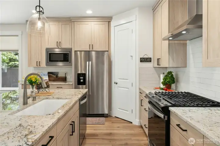 Cabinets have thoughtful roll out trays and trash pull-outs