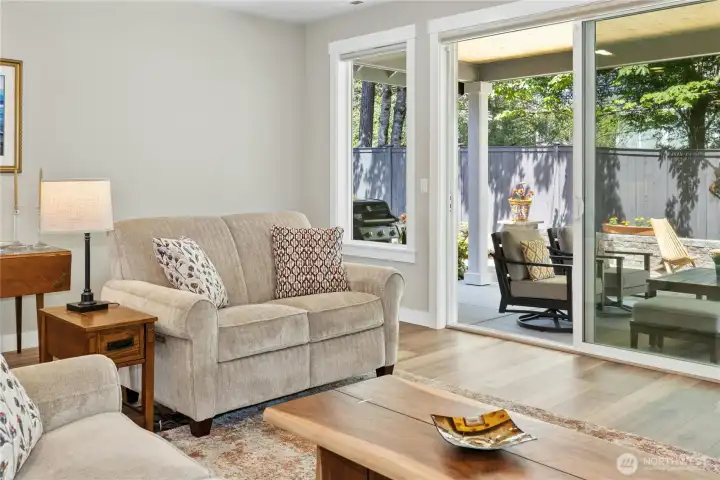 View to the covered patio and beautifully landscaped private yard