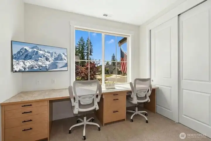 Front bedroom looks to the south, with custom up/down mechanical blinds for privacy and comfort