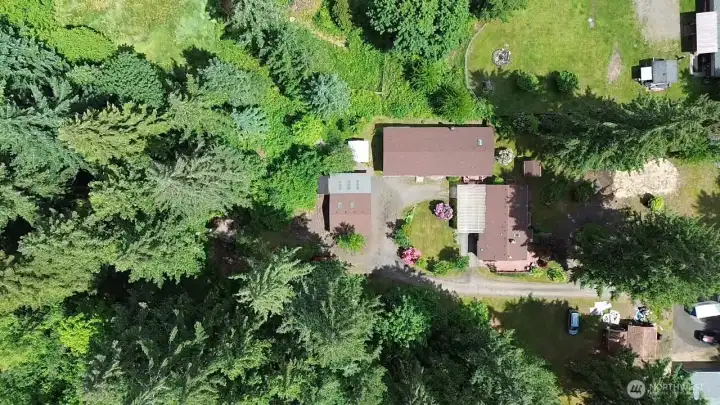 That piece of land you've always wanted, still close to town but a sweet retreat to 3.5 acres of land and all the space to tinker and store "toys" you've ever desired!