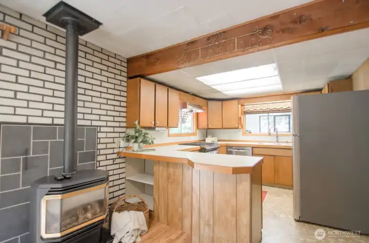 Propane stove warms up the dining room an kitchen.