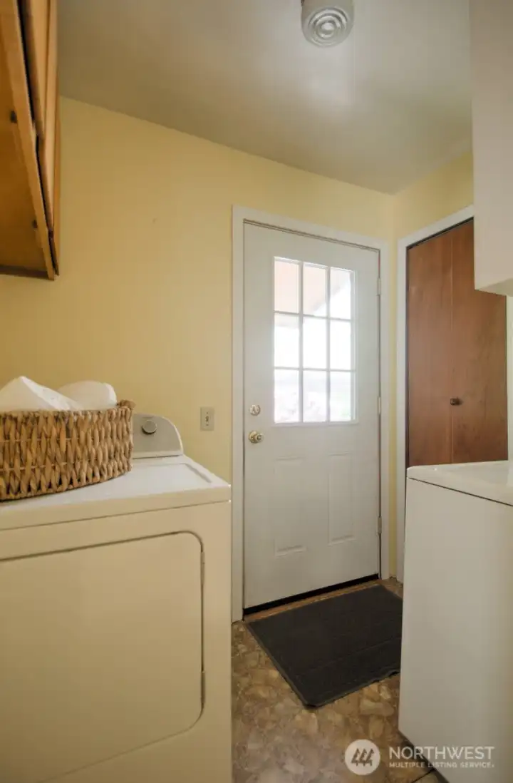 Laundry room off the back entry is handy to the home and washer and dryer stay too.