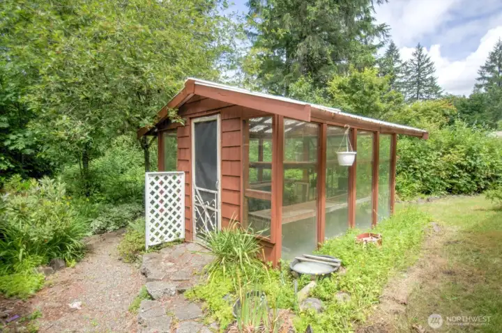 Sweet and useful greenhouse already in place for getting your starts going for a massive garden if you desire.