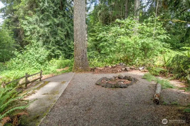 You'll find a fire pit and some simple trails into the back of the property.