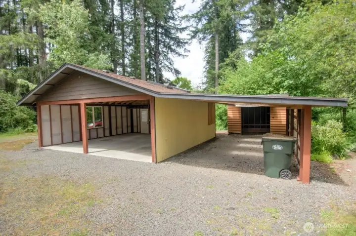 Additional carport and work spaces for epic levels of big toy storage and projects best done under cover.