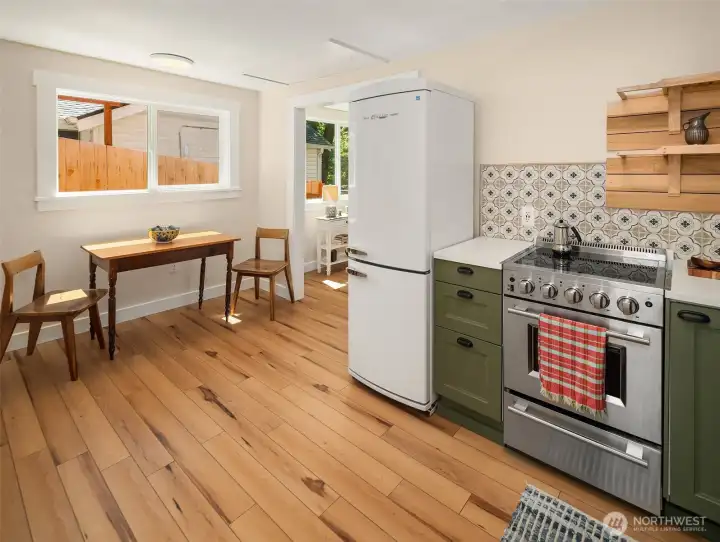 Kitchen with dining nook is generous; the heart of the home.