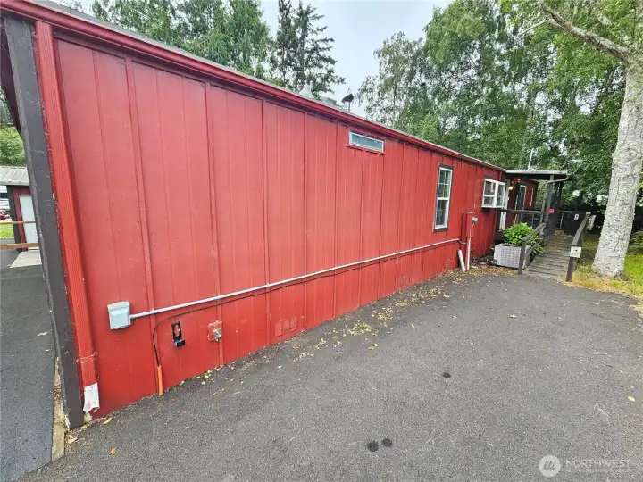 Along the side to the ramp up to the back door.