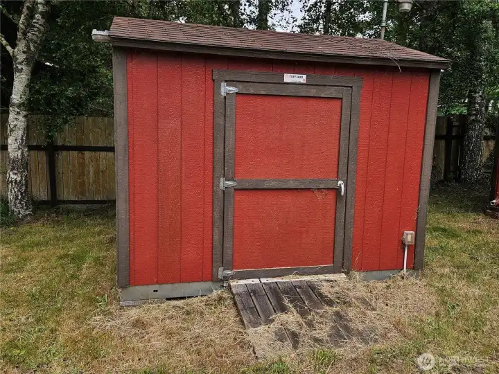 Good sized storage shed in the back yard.