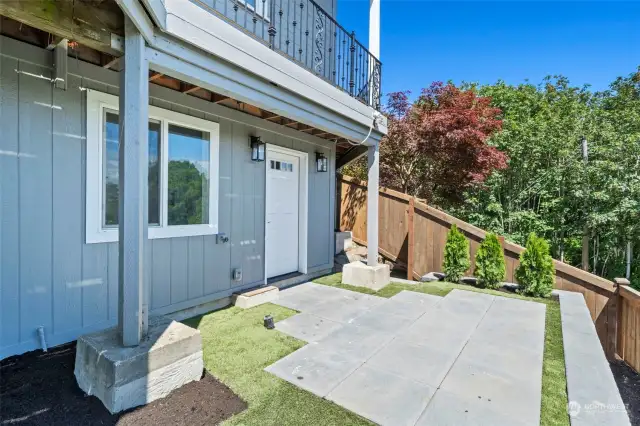 Separate entrance to the MIL/AIRBNB/ADU. There is a professionally landscaped rock pathway just past that fence that leads to the street where additional parking for this MIL/ADU can use, in addition to the pathway that leads to the normal carport/front entrance area..