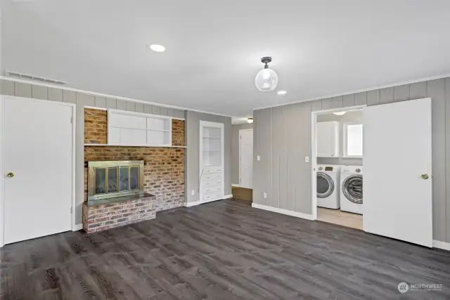 View looking back to front of the home.large Laundry room with plenty of storage and 1/2 bath thru the door to the right.