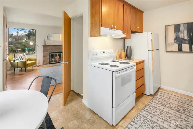 Kitchen of unit 2218, with a side door entrance to the back.