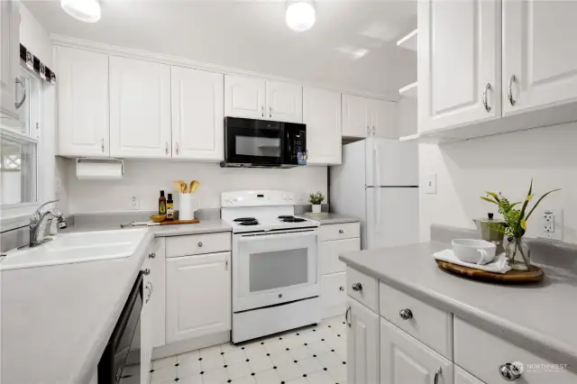 The kitchen provides lots of storage and even has pull out cabinet organizers.