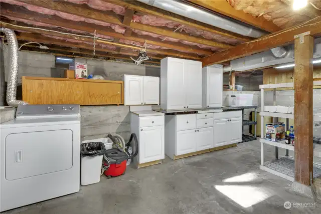 The unfinished basement level has an outside entry from the covered patio. All appliances and cabinets stay with the home.