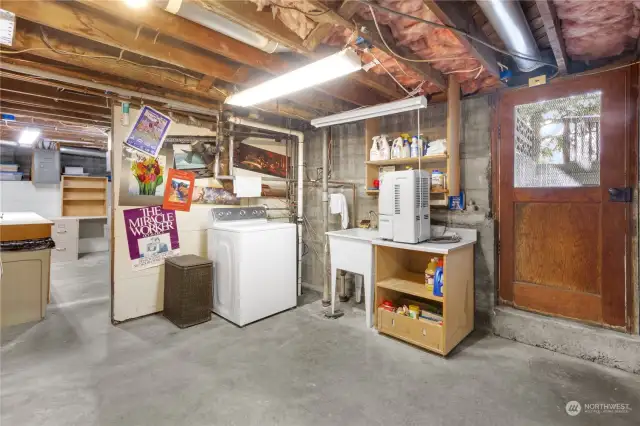 The unfinished basement level has an outside entry from the covered patio. All appliances and cabinets stay with the home.