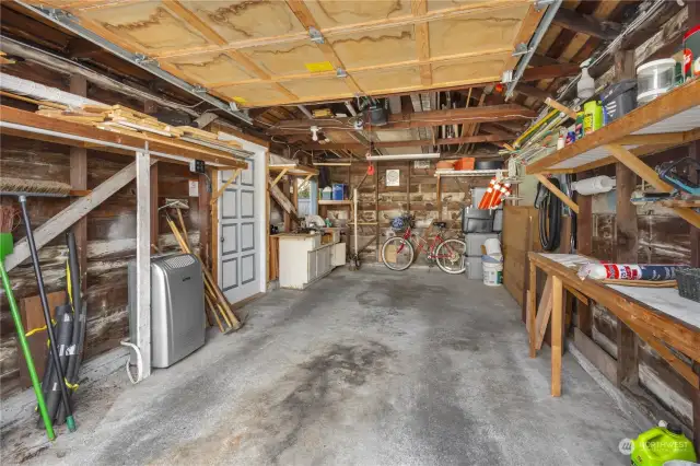 Interior of detached garage. The door to the left leads to the backyard.