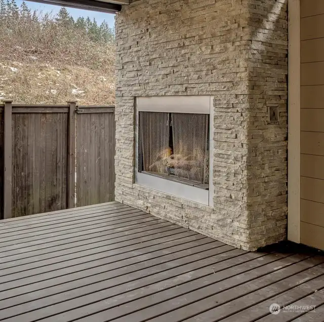 Stone outdoor gas fireplace.