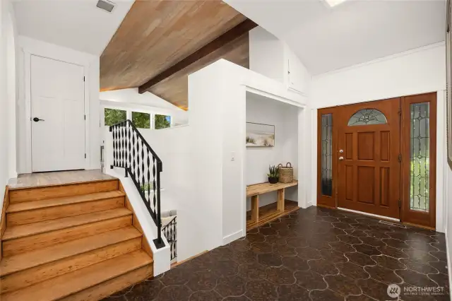 On the upper level of the home, you'll enjoy the sun-drenched living, dining and kitchen.