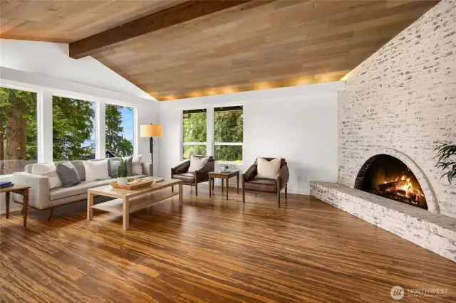 Stylish wood buring, brick fireplace.