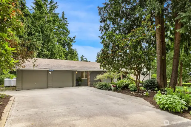 The over size garage has room for 3 cars and has a work bench for thse small projects.   Huge concrete driveway for overflow parking.