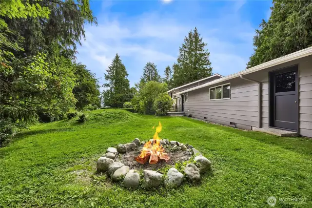 Spacious back yard with firepit.