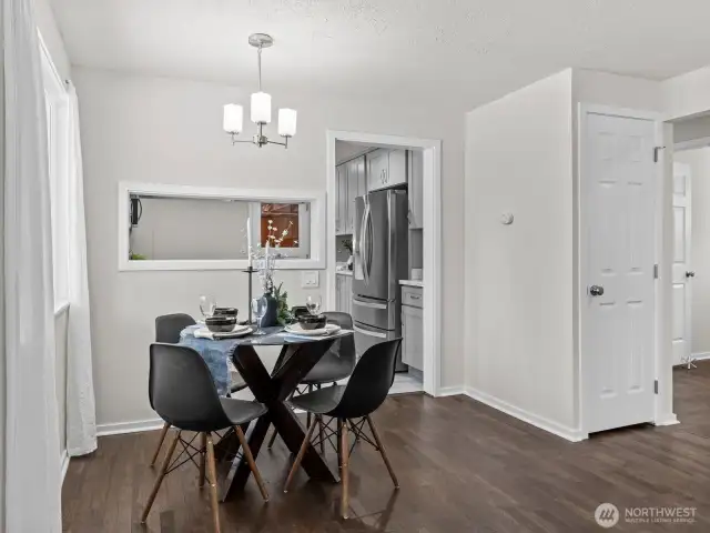 The dining area is adequate size and conveniently located between the living area and kitchen. The passthrough to the kitchen keeps it nice and open feeling.