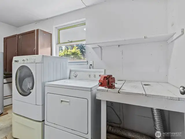 The laundry room is located at the rear of the garage and not calculated in the home's square footage.