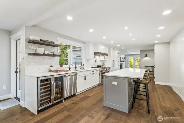 A 10-foot quartz island with bar seats is perfect for breakfast on the go, hosting dinner parties, and watching the chef at work. Wine and beverage fridges make it easy to grab your favorite drinks!