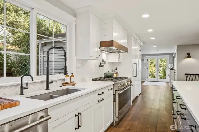High-end appliances by GE and Liebherr are a dream to cook with. The range has 6 burners, a griddle top, dual ovens, and a pot filler!