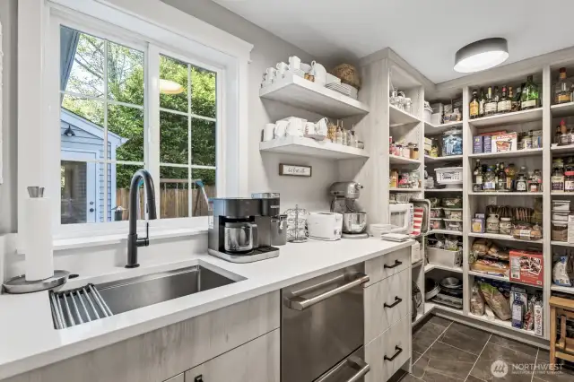TONS of storage space, a second dishwasher, and prep sink are all hidden in here - how cool!
