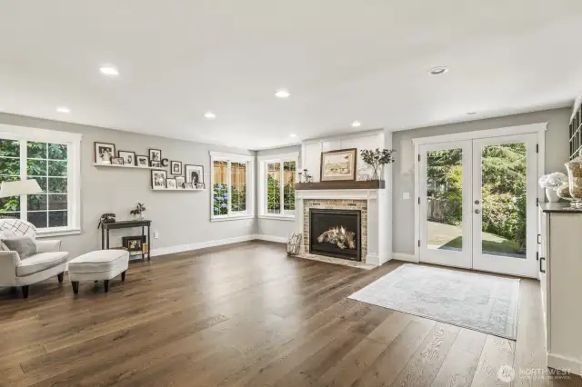 This family room is huge! Flow easily out onto the patio through the French doors on the right.