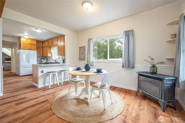 Cozy gas fireplace in corner of dining space