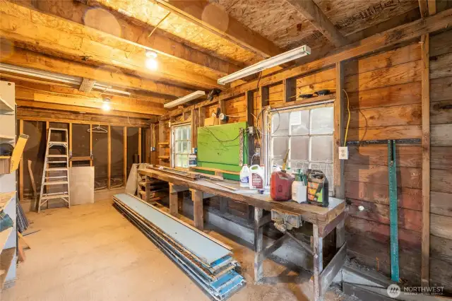 Shop space off garage w/power & slab
