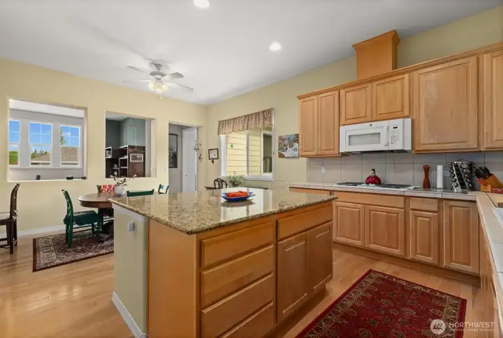 The oversized island is a real functional centerpiece to this space.  This makes entertaining and everyday cooking a breeze.  You know what they say, everyone always ends up in the kitchen and this one has the space to handle it!