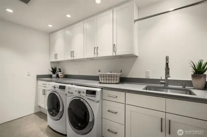 Laundry reimagined: light-filled, spacious, and sleekly organized.