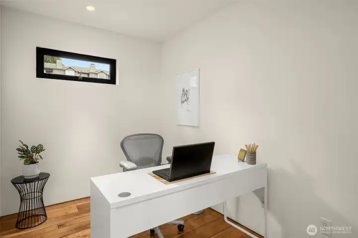 A modern workspace bathed in natural light — productivity paired with inspiration.