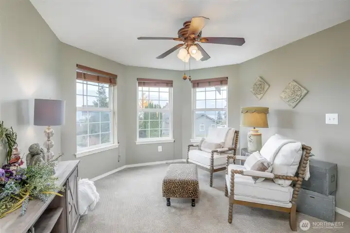 Primary bedroom sitting room with view of the Puget Sound
