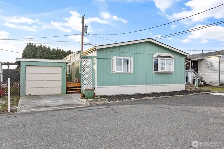 Front of home and garage with new steps and front porch