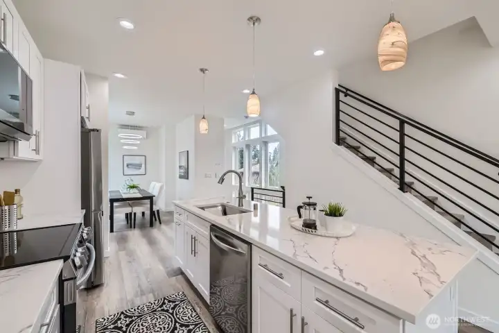 Kitchen looking to the rear of the townhome to the dining area