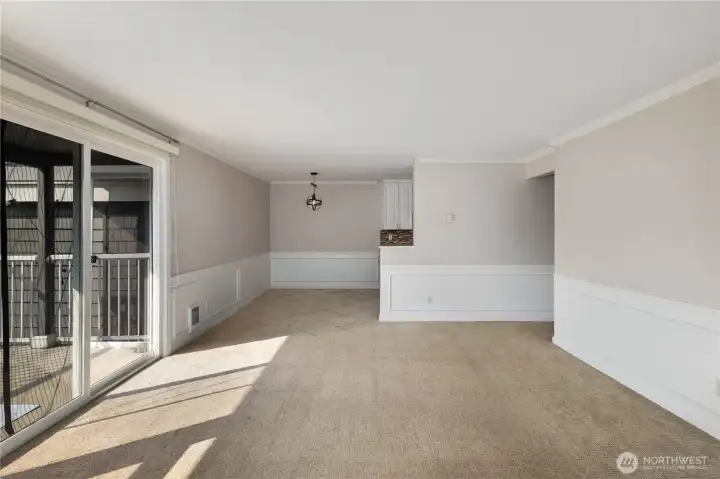 Living & Dining: Open-concept living and dining areas provide versatile space for entertaining or everyday living. Natural light and easy balcony access create a bright, welcoming atmosphere throughout.